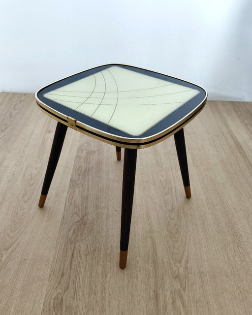 Fifties side table with unusual motif