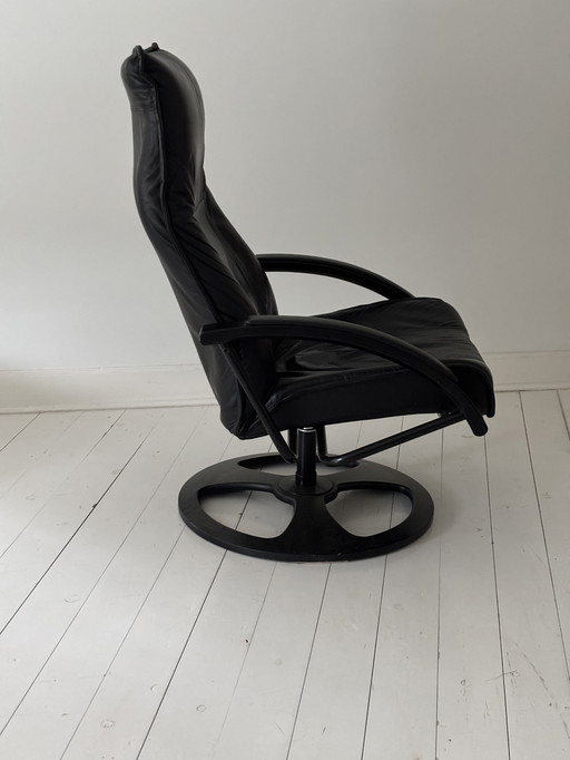 Fauteuil pivotant vintage en cuir noir