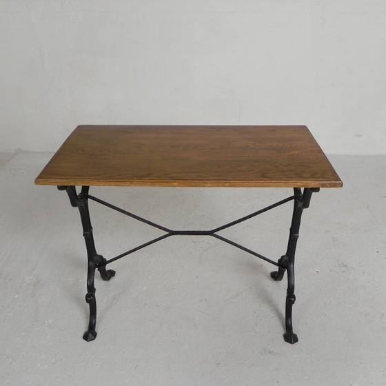 Image 1 of Table de bistrot avec plateau en chêne sur une structure en fonte, années 1930
