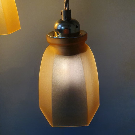 Image 1 of Set Vintage franse gele hanglampen van gekleurd glas.