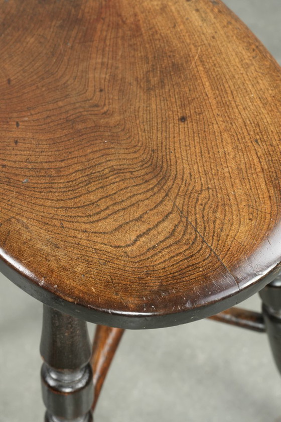 Image 1 of Antique English Windsor stool from the early 19th century with a unique oval shape