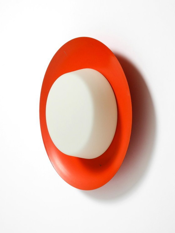 Image 1 of Grote Mid Century wand- of plafondlamp van glas met metalen reflector in rood van Kaiser Leuchten