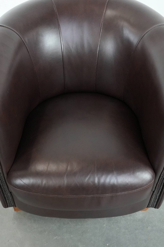 Image 1 of Cowhide club armchair, in very good condition, English style in a brown/dark purple color scheme