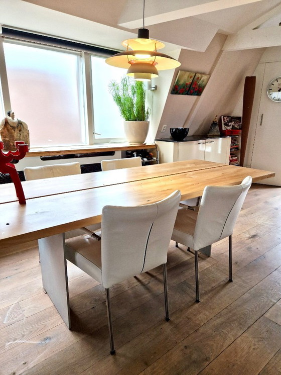 Image 1 of 4 dining room chairs upholstered in white leather