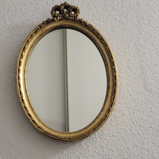 Vintage gold oval bow mirror