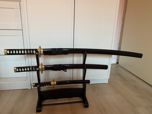 Decorative Daishō samurai sword set with wooden stand