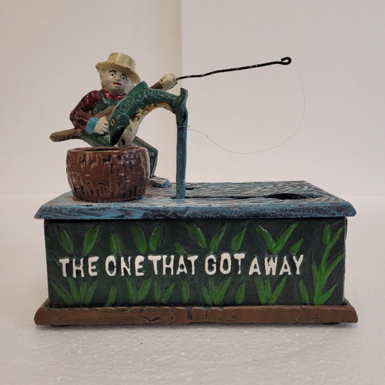 Image 1 of "Fisherman" piggy bank with fishing mechanism, cast iron, 1950s - USA.