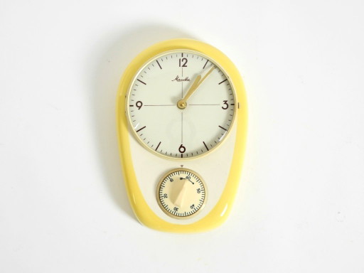 Beautiful battery-operated Mid-Century Modern wall clock by Mauthe with a glazed ceramic case