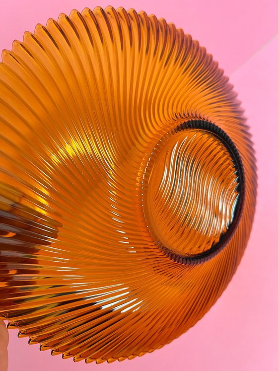 Image 1 of Vintage 70s swirl amber glass amber sunburst fruit bowl sawtooth edge orange