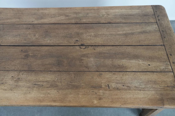 Image 1 of Robust antique French 6-person dining table made of fruit wood with 3 drawers from the late 18th century