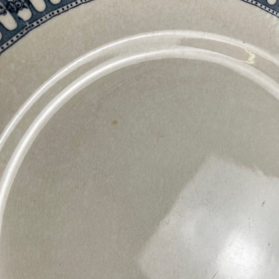 Image 1 of Plato redondo de loza procedente de Salins, de finales del siglo XIX o principios del siglo XX.