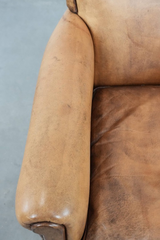 Image 1 of Subtiele vintage schapenleren fauteuil/ armchair met een mooie lichte kleur en sierlijke pootjes