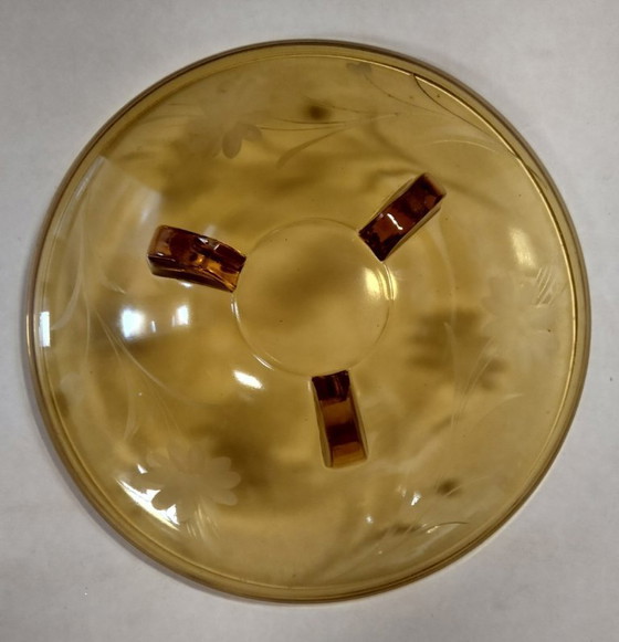 Image 1 of ciotola color ambra su gambe con motivo floreale