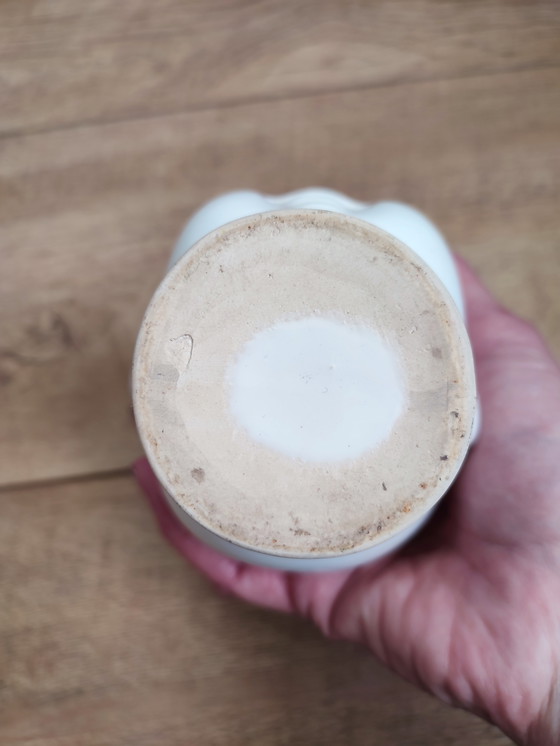 Image 1 of Pot de fleurs vintage en céramique blanche, motif tête d'enfant.