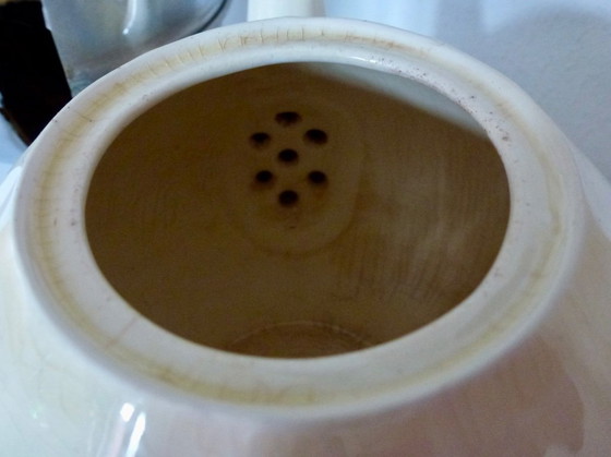 Image 1 of Ceramic Teapot with thermal Chrome casing which keeps the contents hot (or cold).