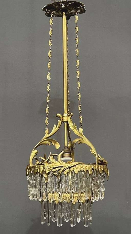 Antique chandelier in gilded bronze with crystal pendants. – kroonluchters (photo 2 of 7)
