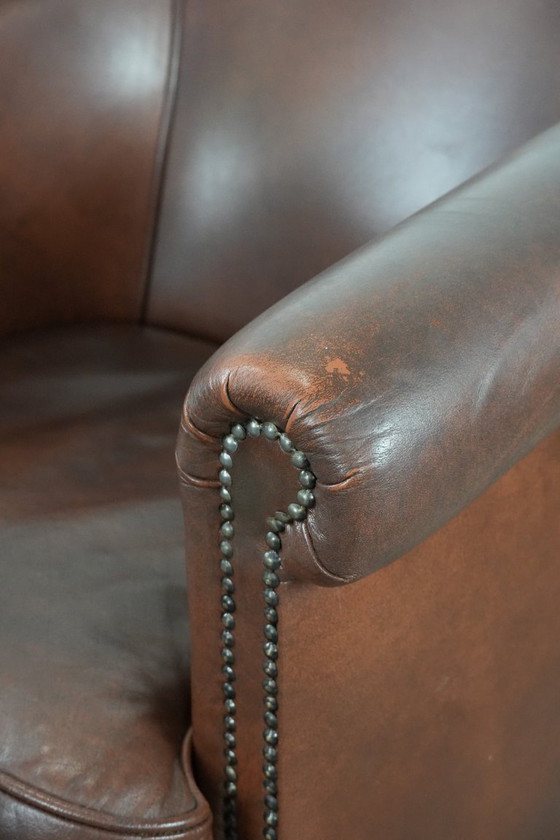Image 1 of Cognac-colored cowhide leather club armchair in English style with a luxurious appearance