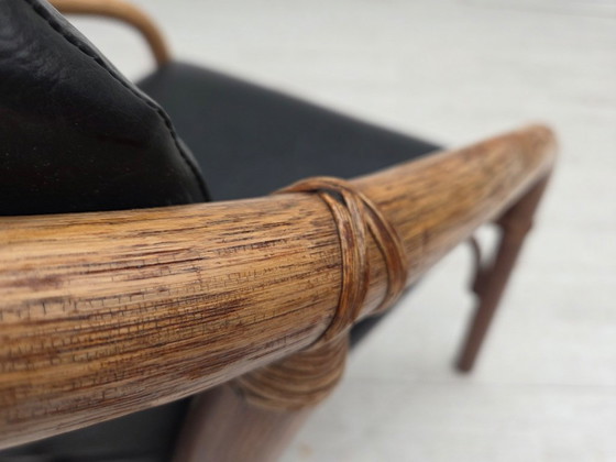 Image 1 of 1970s, Danish armchair, rattan, black artificial leather.