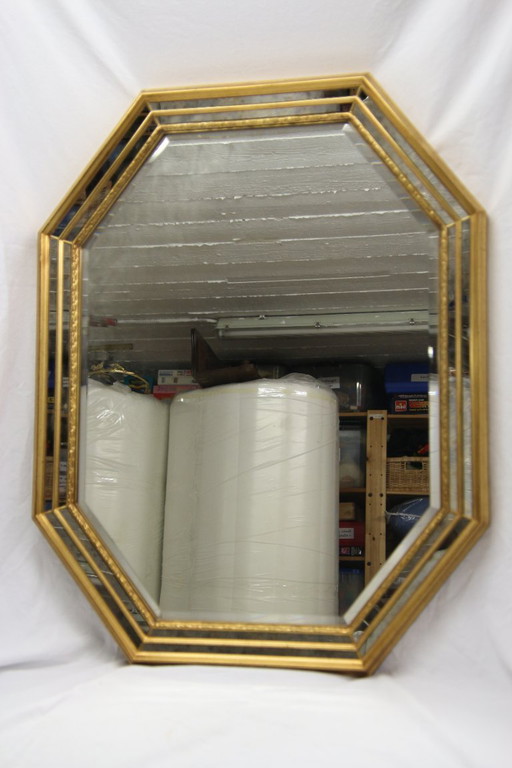 1 large wall mirror with gold embossed decoration