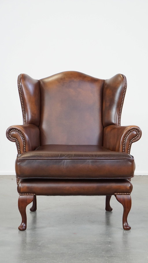 Fauteuil à oreilles en cuir de bœuf