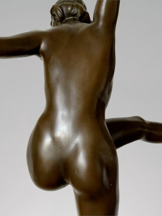 Image 1 of Art Deco sculpture of a dancer with rings in patinated bronze on a black marble-effect base – signed Duvernet – 58 cm