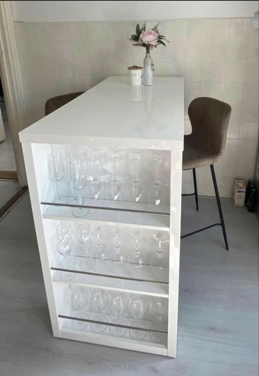 White high-gloss bar table kitchen wine rack or glass rack and with two taupe bar stools