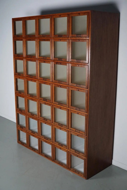 Antique large Dutch oak haberdashery cabinet with hinged doors, 1920s/30s