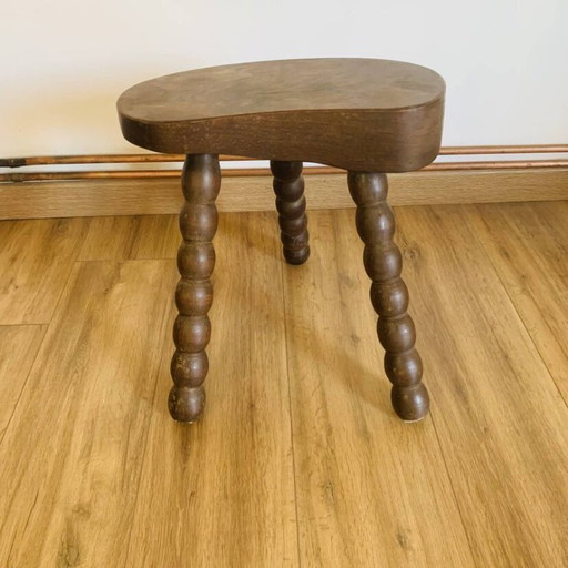 Taburete vintage con patas de carrete