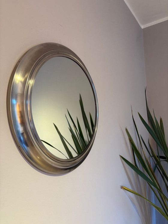 Image 1 of round mirror with metal frame, dating back to the 1970s