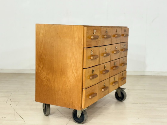 Image 1 of Beautiful vintage apothecary cabinet / compartment cabinet on casters – 16 compartments