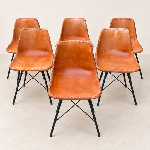 Set of 6 cognac chairs with cross stitching and black metal legs
