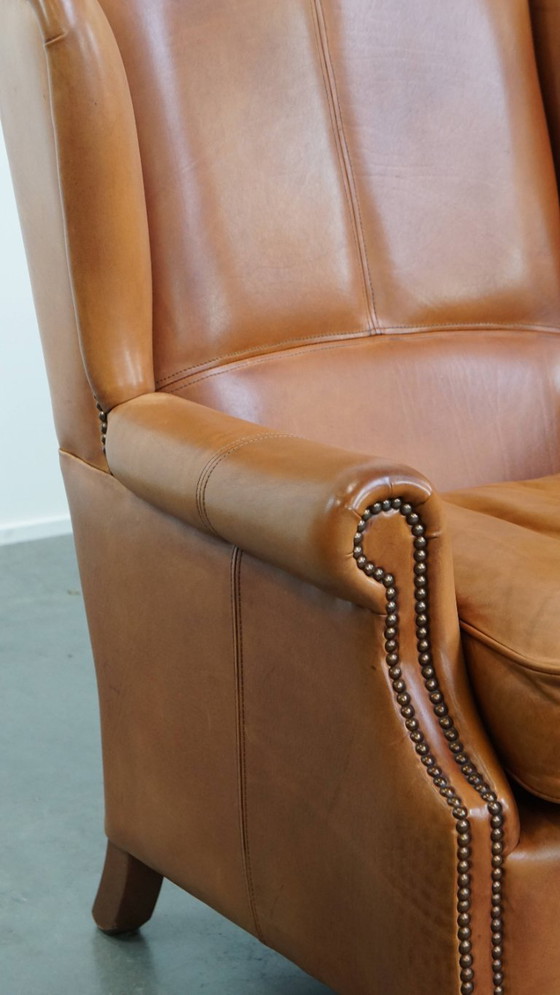 Image 1 of 2x Rundleren oorfauteuil afgewerkt met siernagels