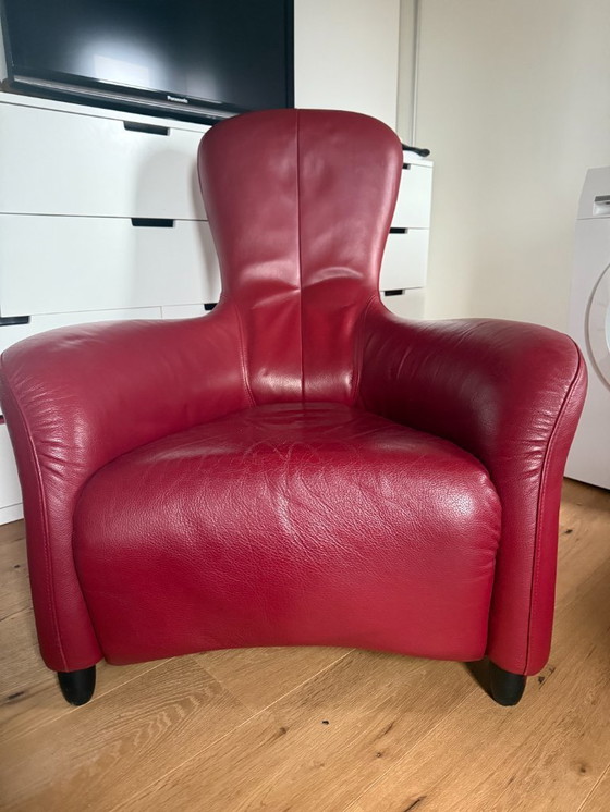 Image 1 of Montis Loge fauteuil met voetenbank in rood leer 