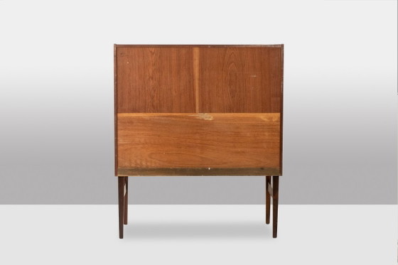 Image 1 of Commode van palissanderhout met 2 laden, die tevens als secretair dient. Jaren 70.
