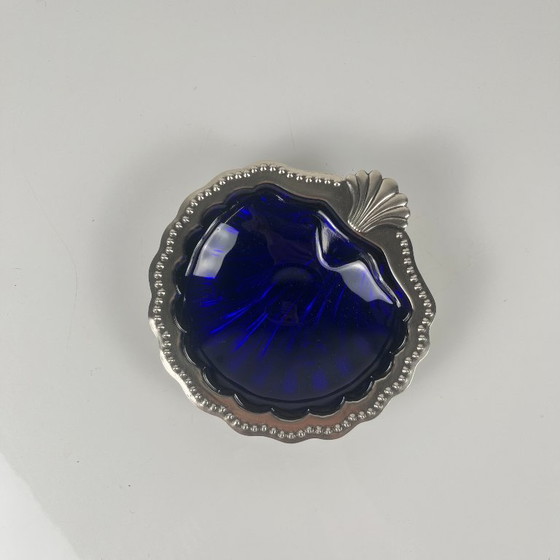 Image 1 of Trinket dish / Open butter dish in silver-colored metal with a seashell shape and blue glass insert, 1970