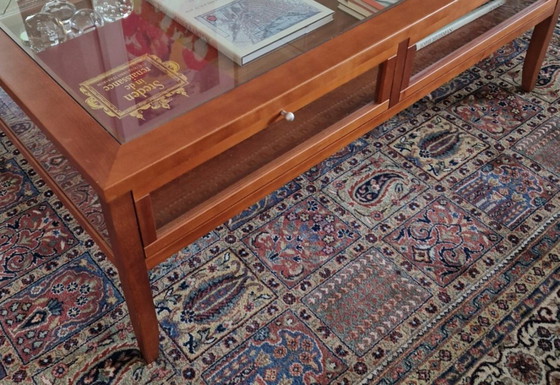 Image 1 of Beautiful cherry wood coffee table with glass top and display shutters
