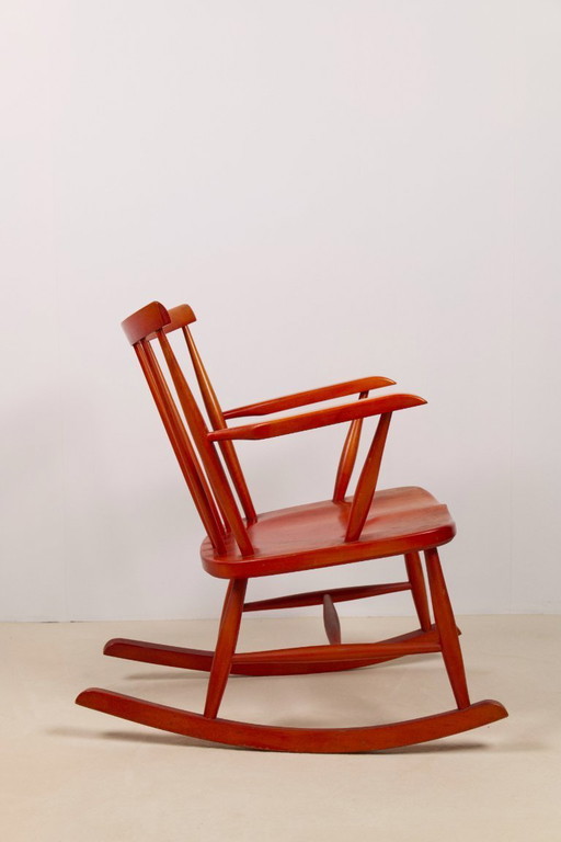 Red stained beech rocking chair, 1960's