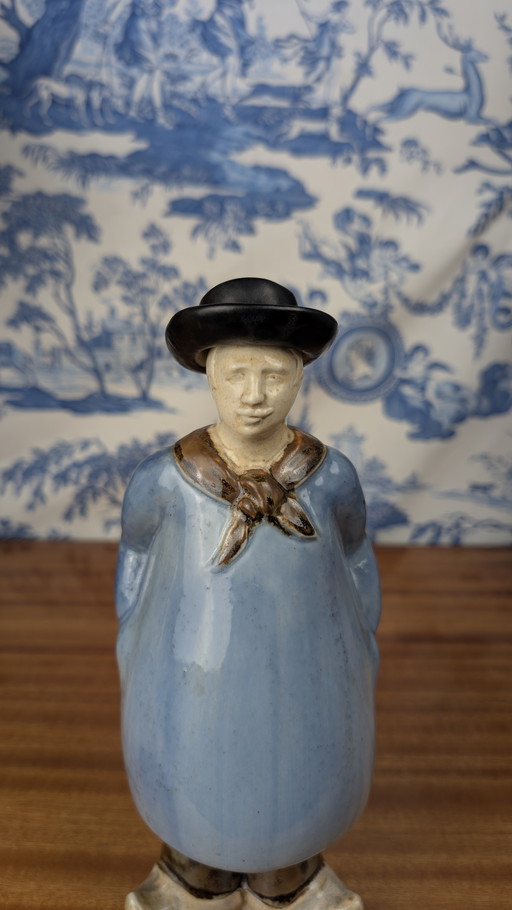 Denbac pour Noyer anthropomorphic liqueur bottle of a Berrichon shepherd, early 20th century ceramics