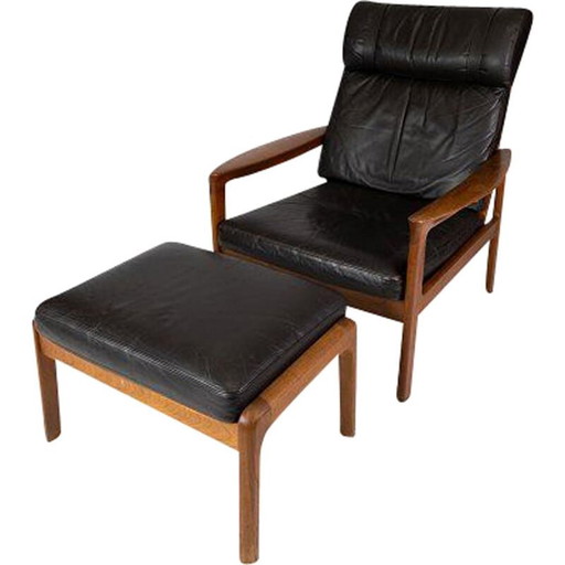 Sillón vintage con taburete de teca tapizado en cuero negro de Arne Vodder para Komfort, 1960