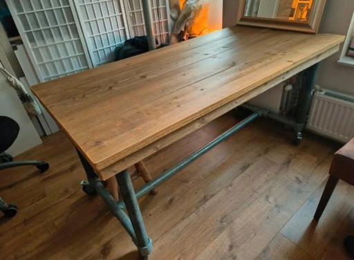 Beautiful scaffolding wood industrial table on wheels
