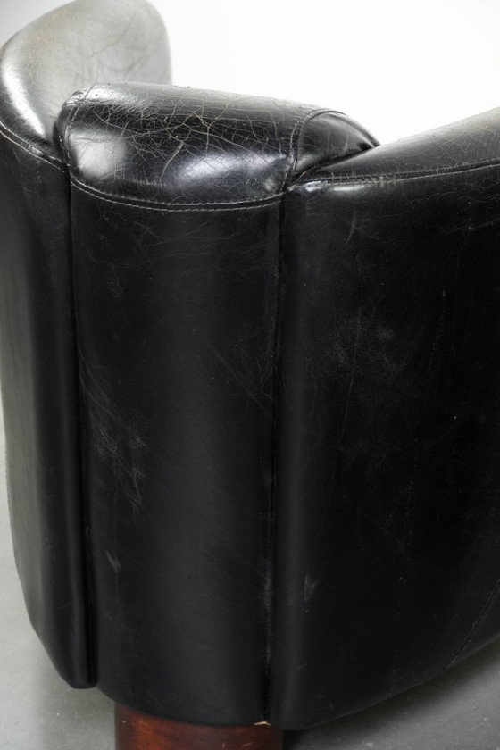 Image 1 of 2x rugged black vintage cowhide Aviator design armchairs with a distinctive look