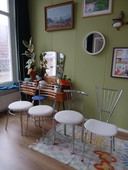 Four stainless steel chairs with boucle fabric
