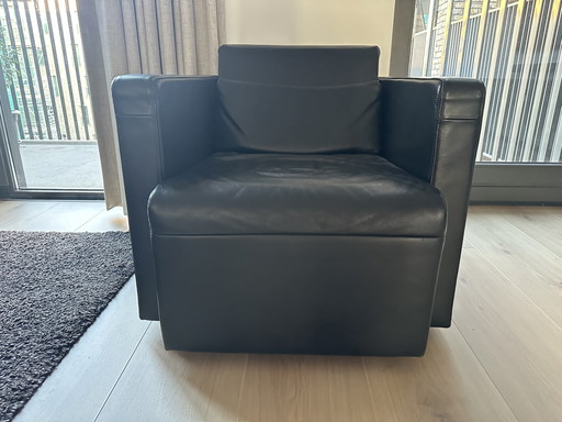 Black leather swivel armchair by Jori