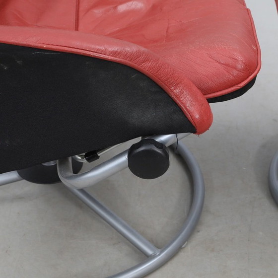 Image 1 of IKEA red leather armchair designed by K. Hagberg – M. Hagberg, from 2000–2010, with a tubular steel tripod base