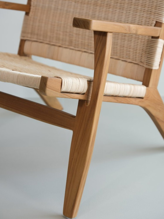Image 1 of Poltrona lounge Valbona realizzata in teak massello e rattan intrecciato a mano.