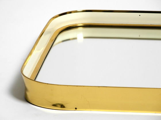 Image 1 of Prachtige originele Mid Century Moderne "Zier-Form" wandspiegel met zware messing lijst door "Münchener Zierspiegel".