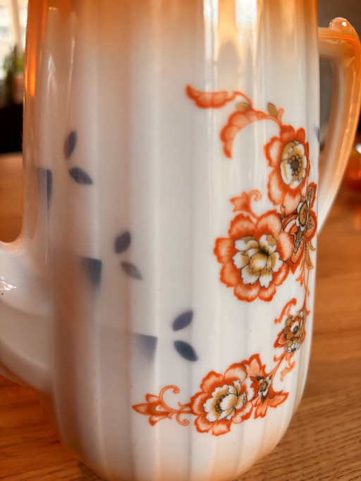 Thee/koffiepot oranje met bloemen