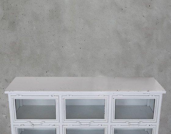 Image 1 of Vetrina vintage in metallo con 9 ante a ribalta in vetro.