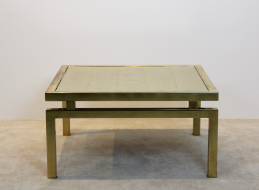 Goud geëtst glazen salontafel op een elegant messing frame