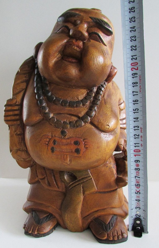 Hand-carved wooden statue of the Laughing Buddha